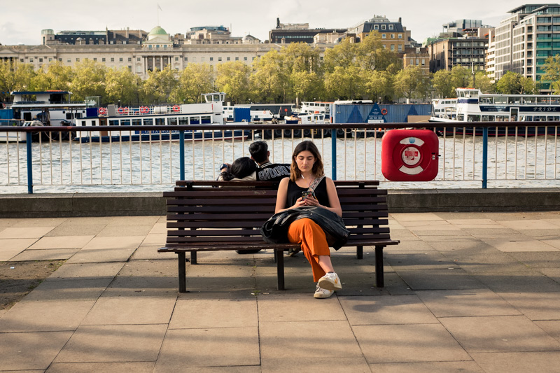 People spread across a public seating area by Jukka Heinovirta
